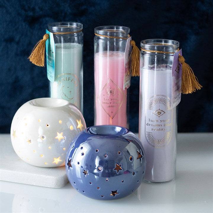 White Sage Tube Candle surrounded by decorative holders, featuring clear quartz crystals for enhanced energy and ambiance
