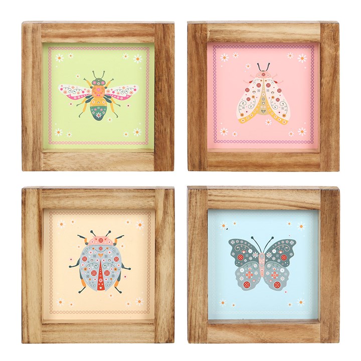 Set of 4 framed floral bug wall art prints featuring colorful insects, perfect for a nature inspired wall art set