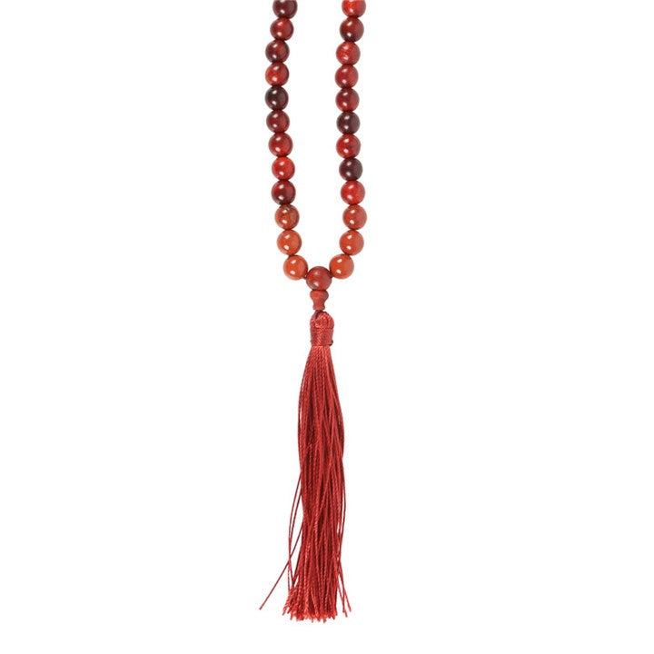 Grounding Mallah necklace made of Rosewood and Red Jasper beads, featuring a red tassel for spiritual connection.