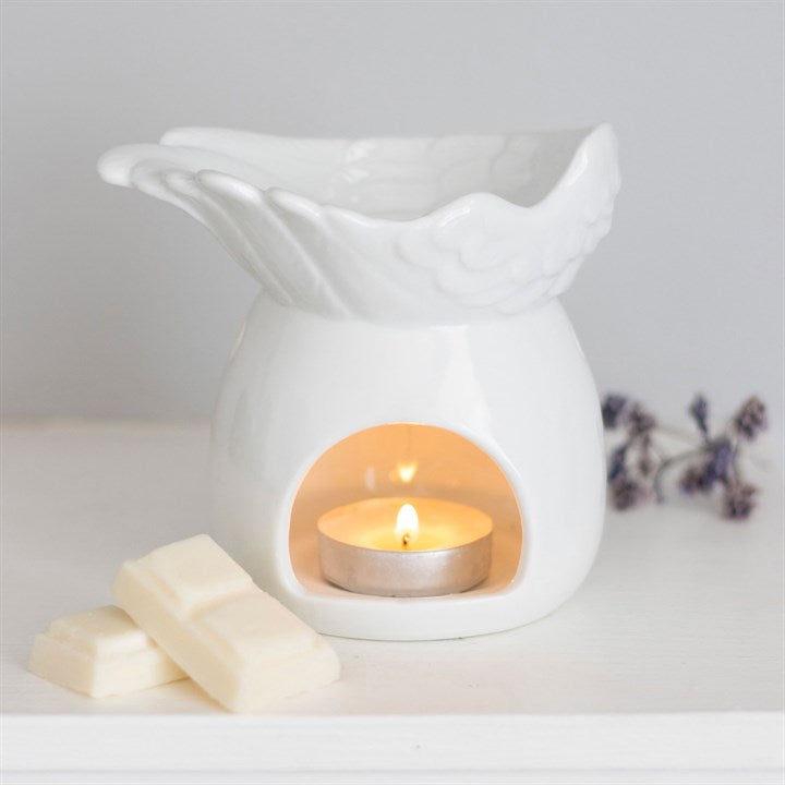 Elegant Angel Wing Dish oil burner in white ceramic with a tealight candle, perfect for fragrance and ambiance