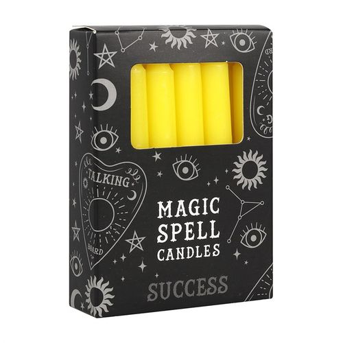 Set of 12 yellow spell candles in a decorative black box labeled 'Magic Spell Candles - Success' for spiritual rituals