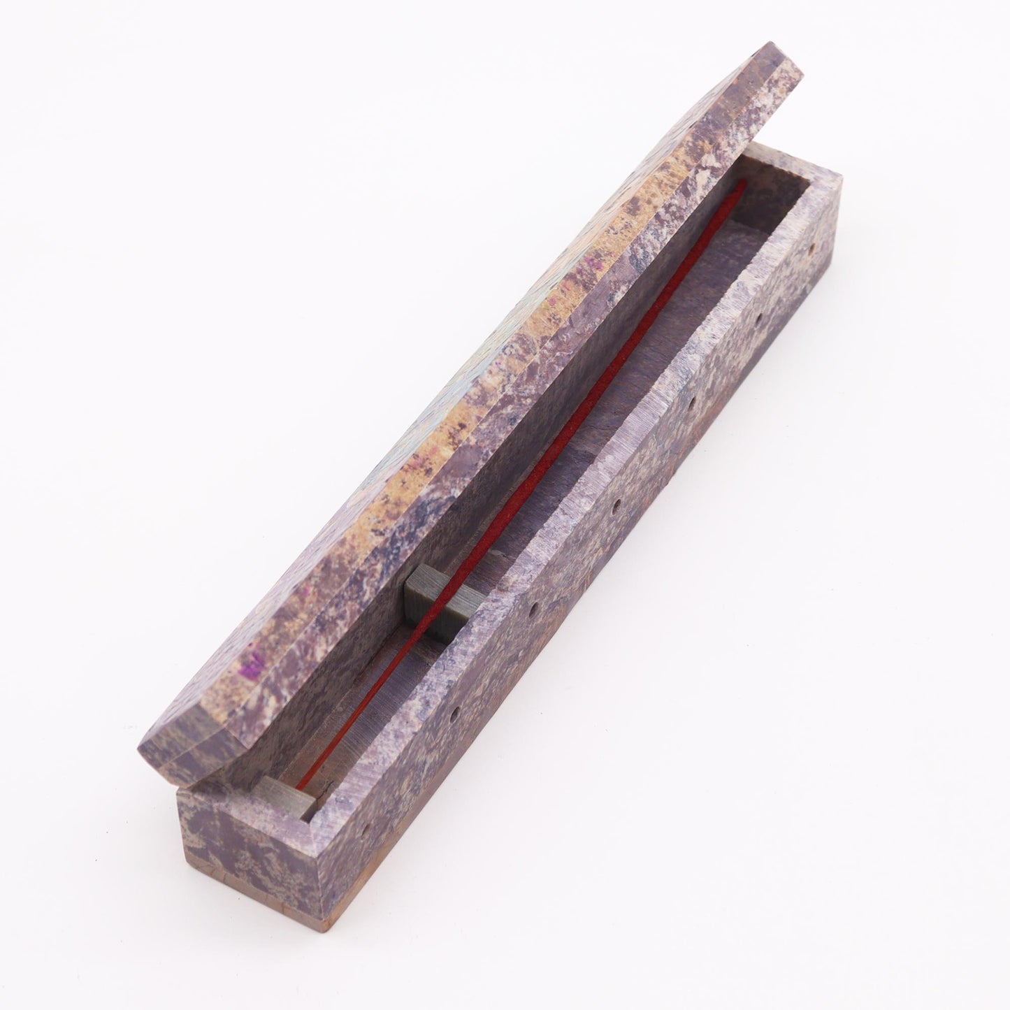 Chakra soapstone incense holder featuring a handcrafted design for burning incense sticks elegantly.