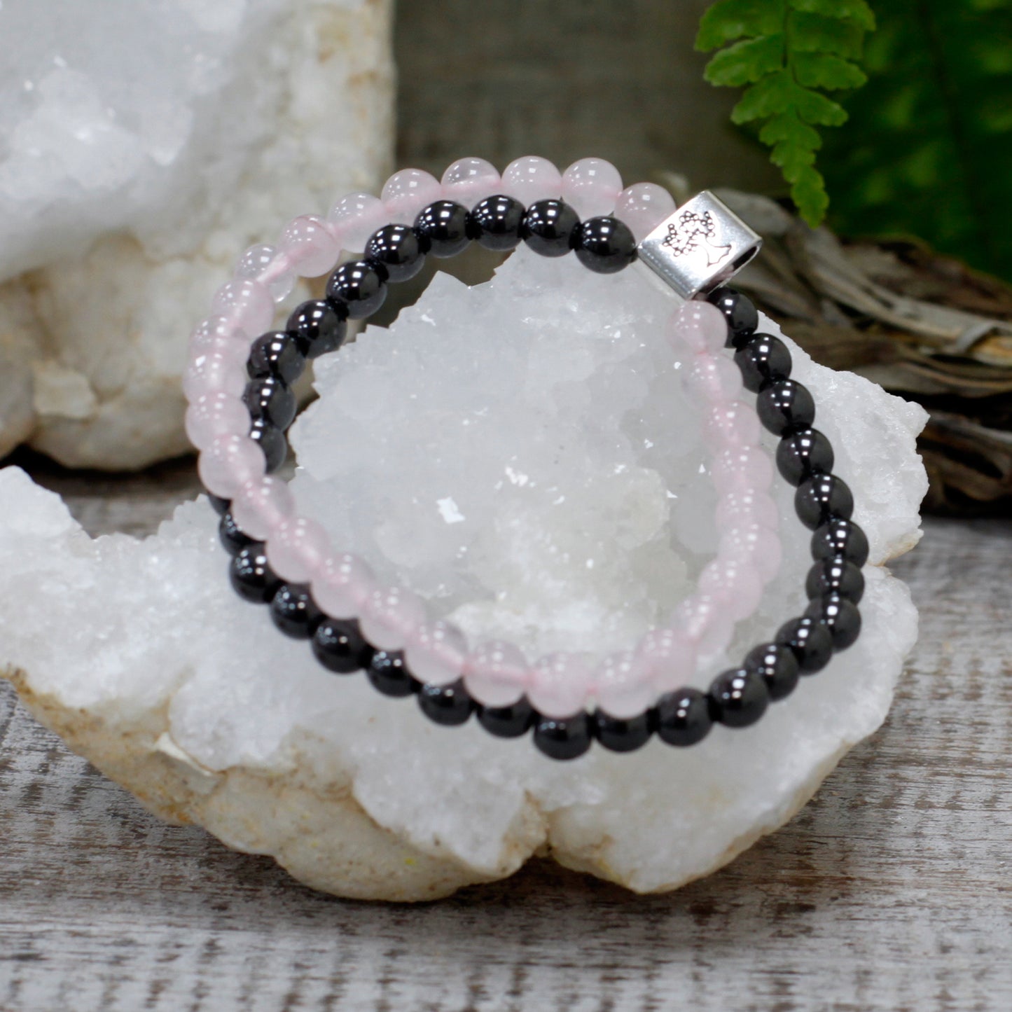 Elegant rose quartz magnetic bracelet with black beads for healing and style at Kimchi Toki.
