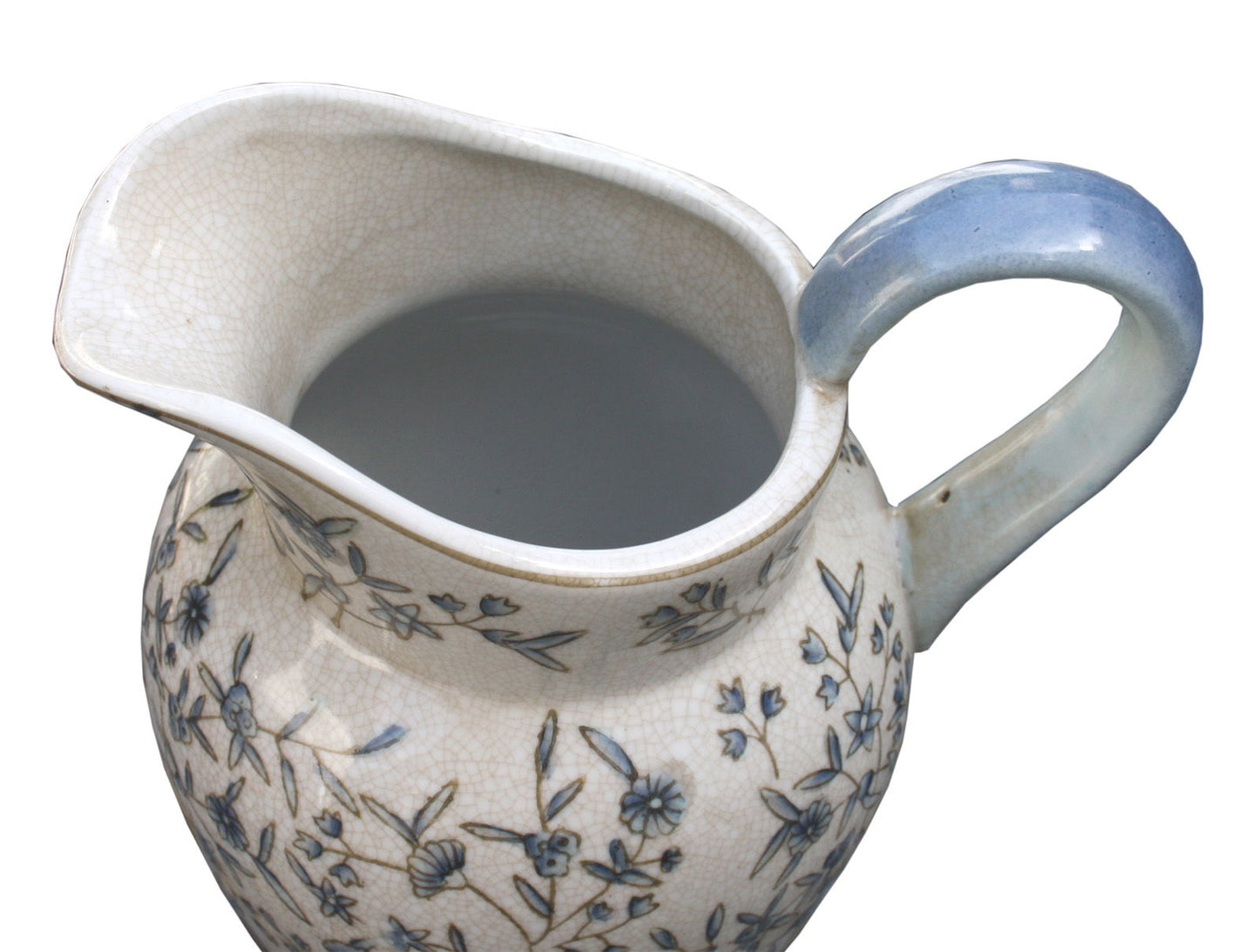 Blue and white decorative jug with floral patterns and a curved blue handle