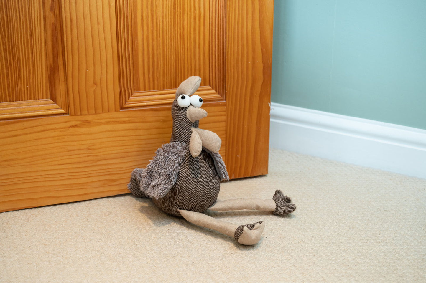 Cute brown chicken doorstop made of soft material to keep doors ajar safely