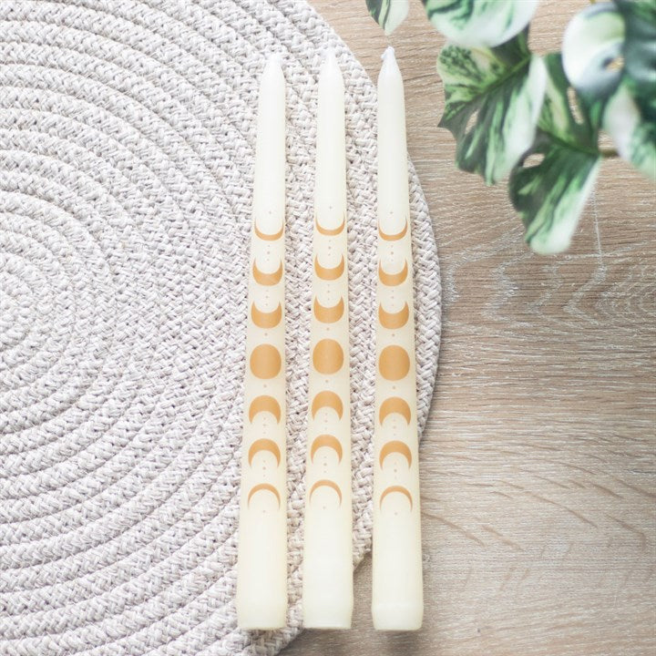 Set of 3 Off White Moon Phase Taper Candles with unique lunar designs for elegant dinner decor