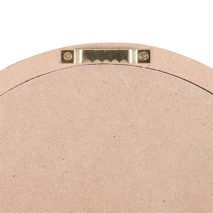 Back view of Carrot Patch round wall decor with hanging hardware for easy installation