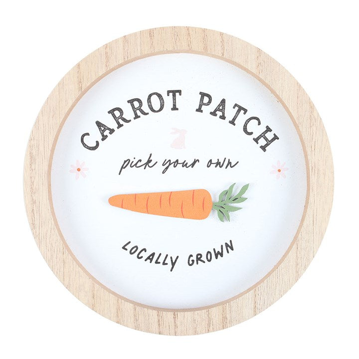 Carrot Patch wall decor featuring a round 3D wall plaque with a carrot illustration and text
