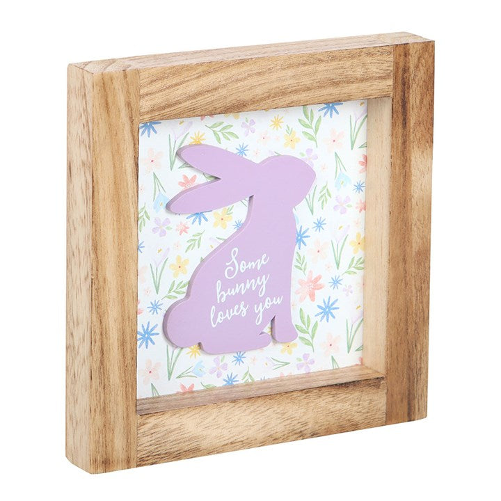 Cute bunny frame decor featuring a purple rabbit silhouette and floral background saying Some Bunny Loves You
