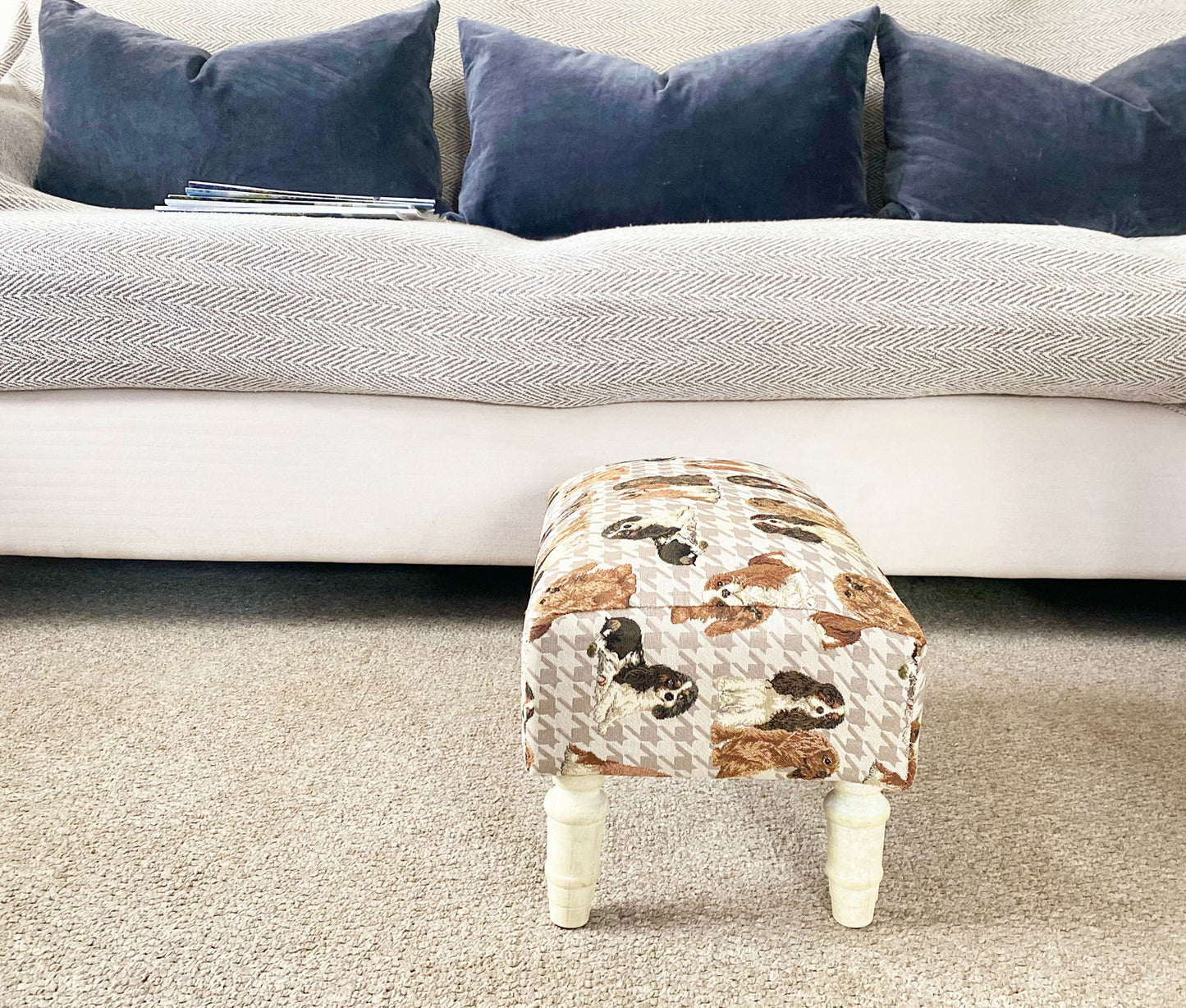 Geko Products decorative animal footstool with dog print upholstery on white wooden legs in living room
