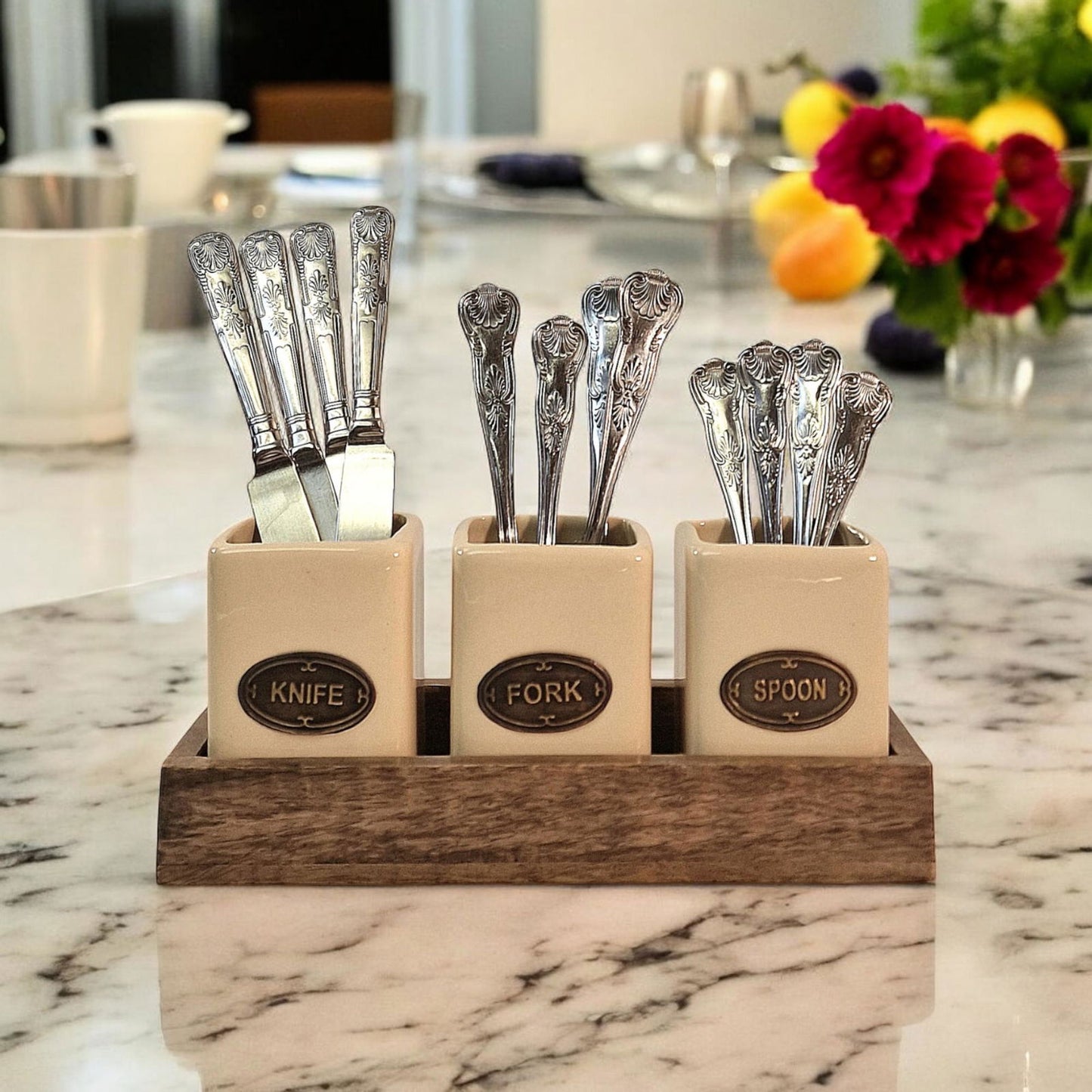 Geko Products ceramic knife fork spoon holder with vintage silverware and wooden base on marble countertop