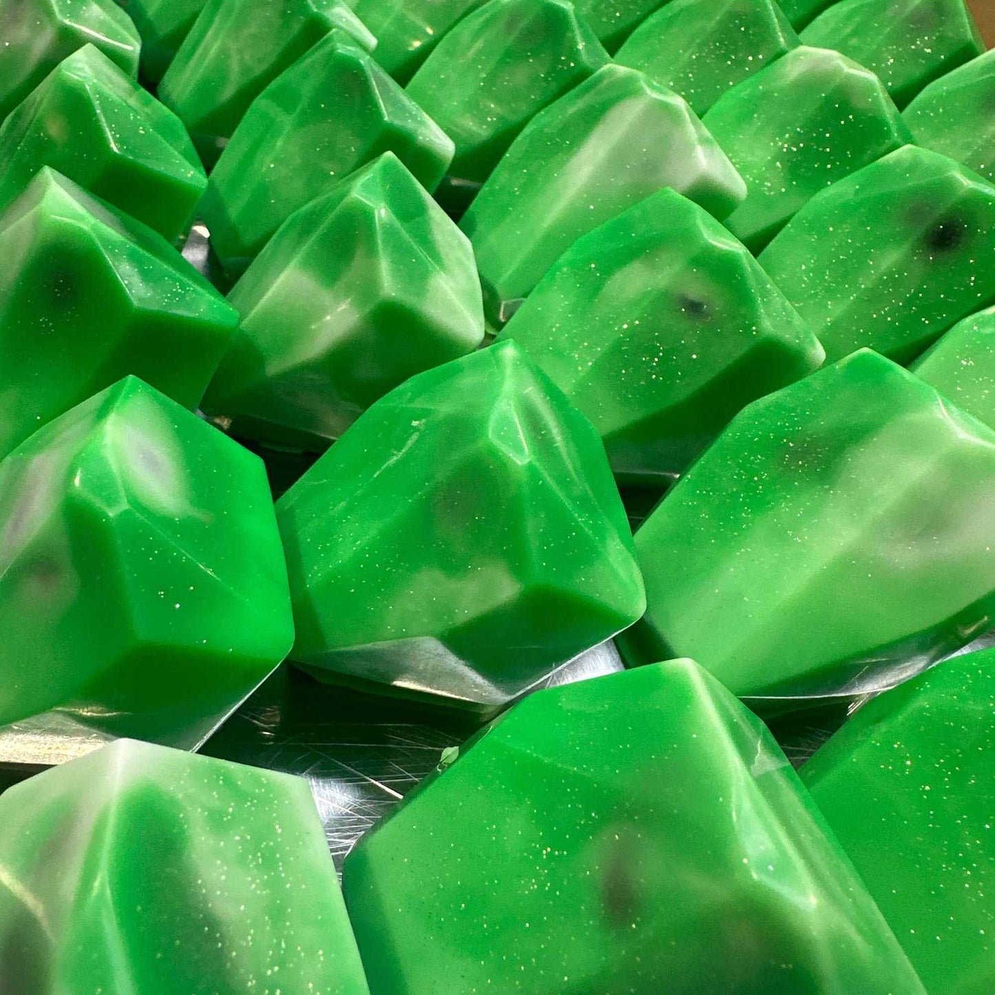 Earth Elemental Soap shaped like green gemstones with a sparkling finish for a refreshing clean.