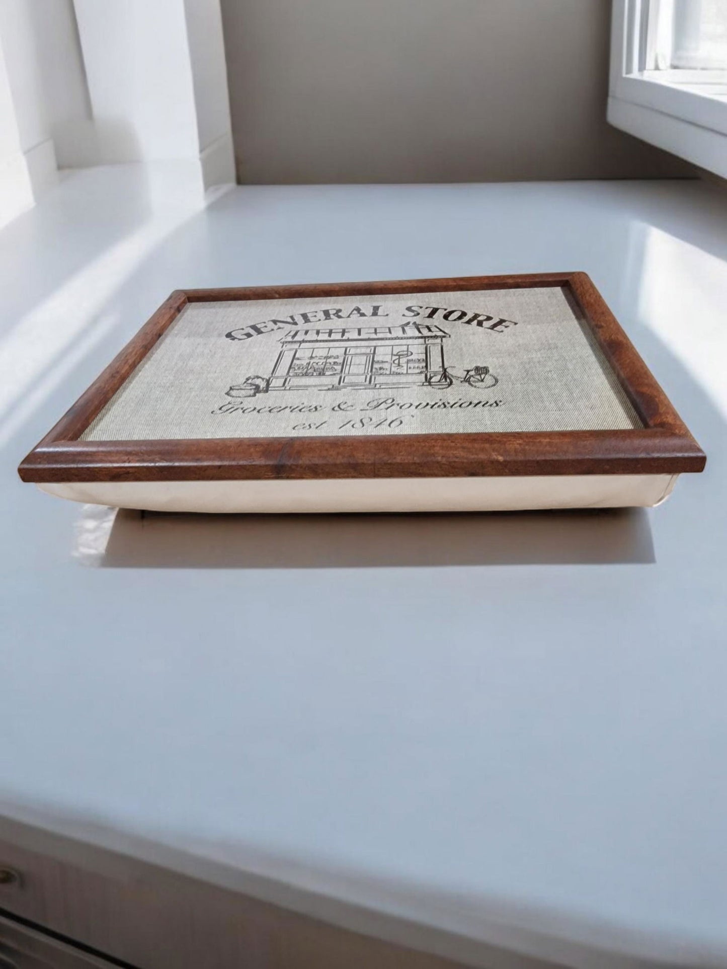 Geko Products General Store Lap Tray with wooden frame and vintage store design on cushioned surface