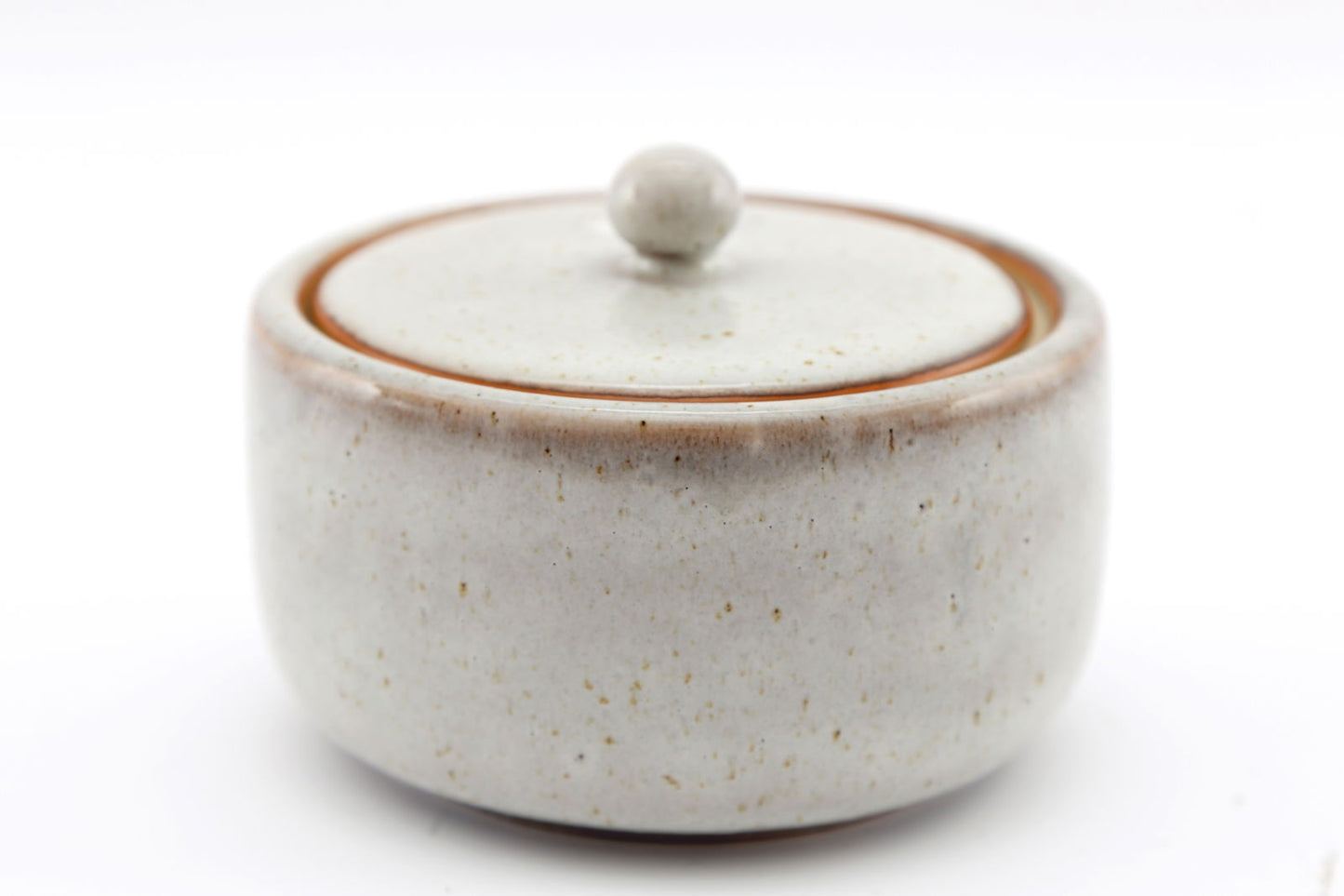 Geko Products taupe ceramic pot with lid featuring a smooth rounded design and subtle speckled texture
