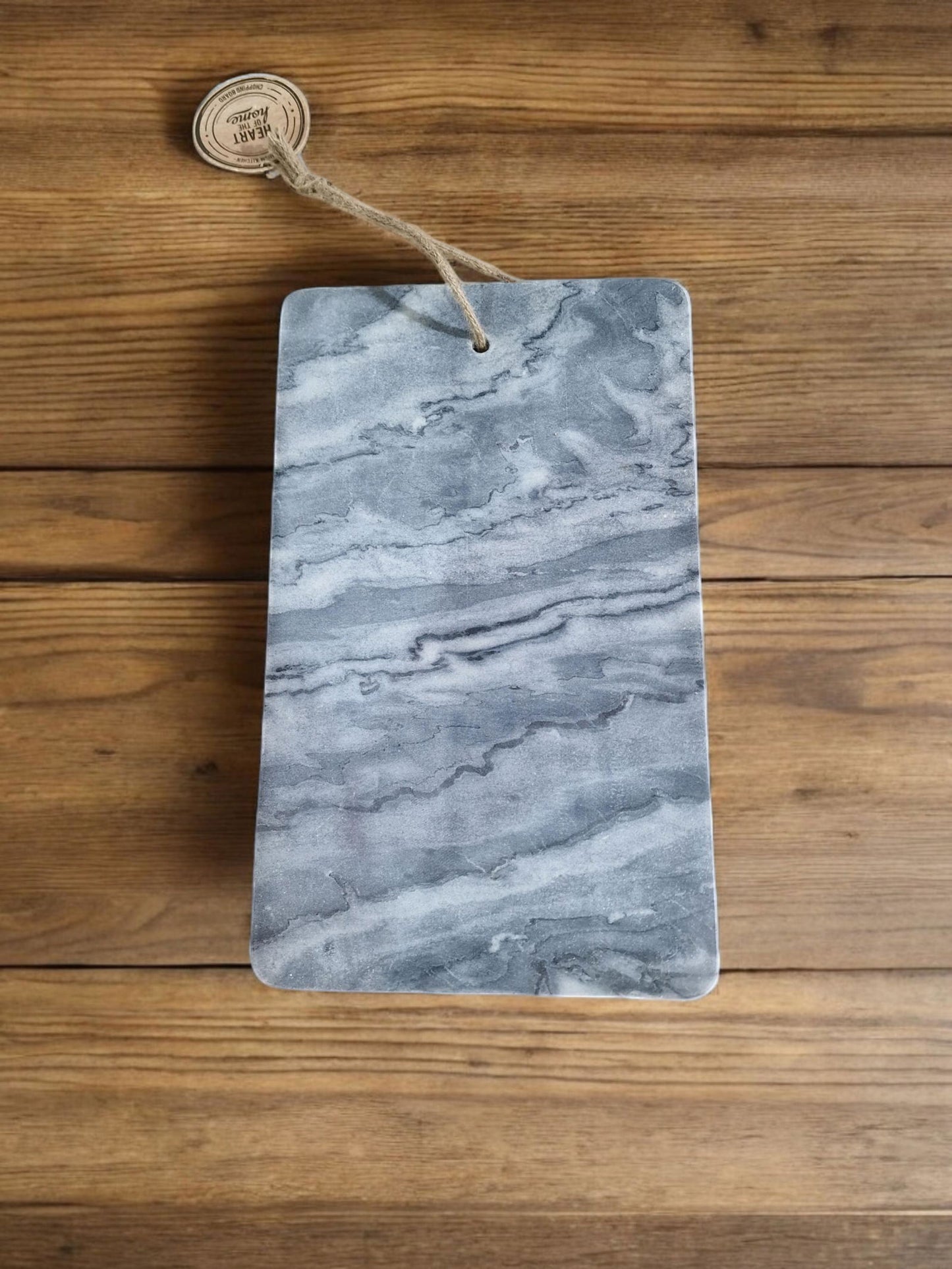 Geko Products grey marble chopping board with natural stone texture and rope handle on wooden surface