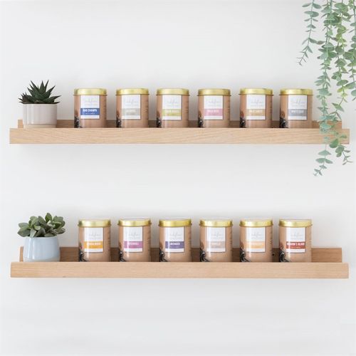 6 Tins of Elements Lavender Jumbo Backflow Cones displayed on wooden shelves next to decorative plants