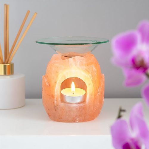 Lotus flower shaped Himalayan salt oil burner with a candle and glass dish for essential oils