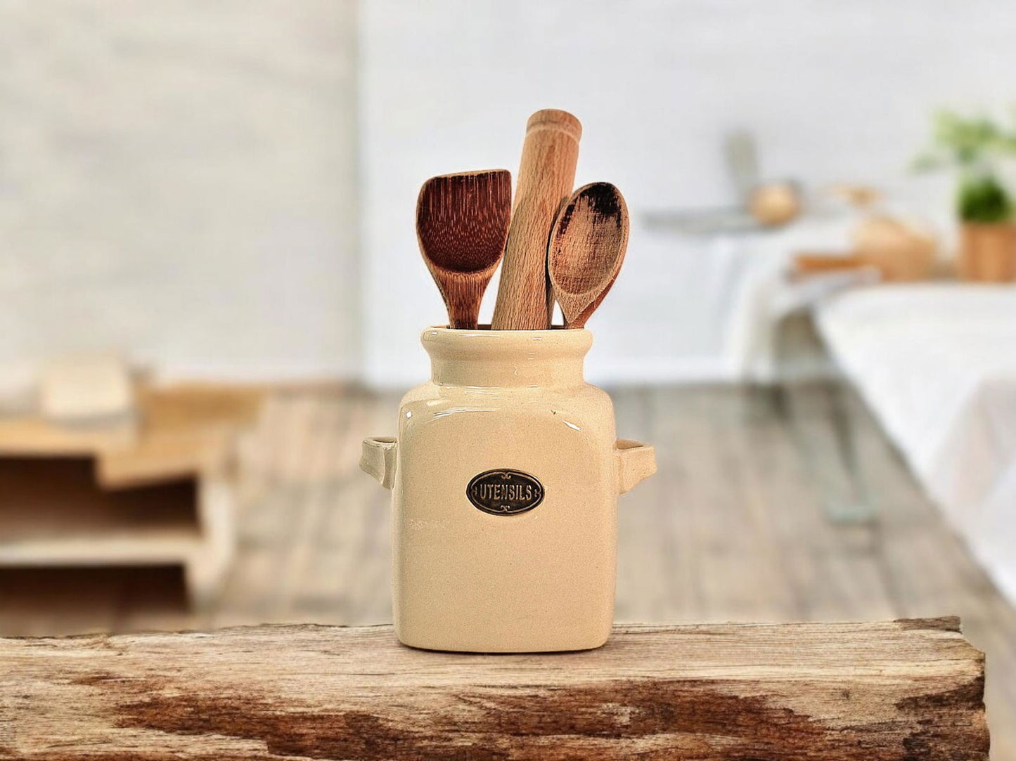 Geko Products kitchen storage jar holding wooden cooking utensils on a rustic wooden surface