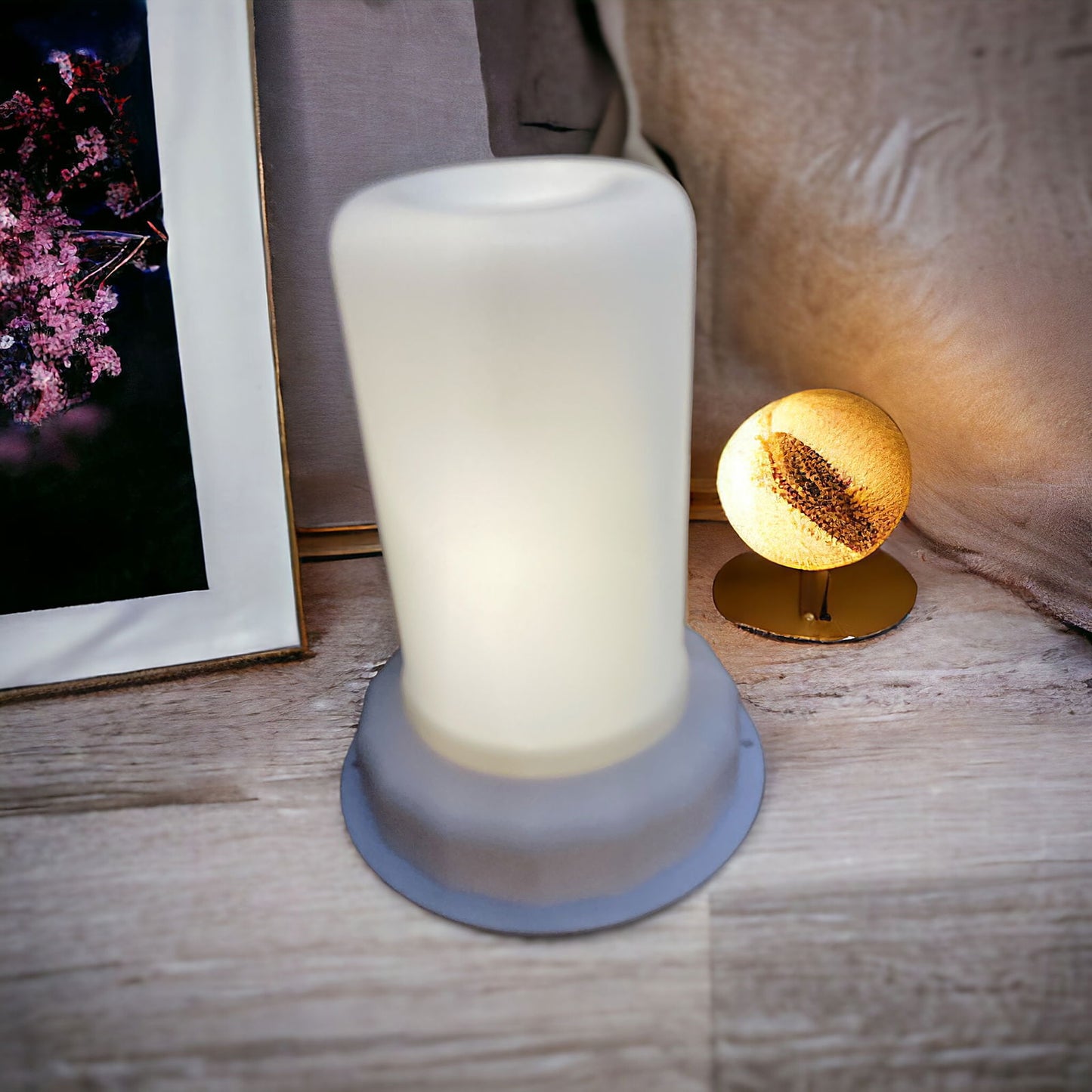 Geko Products LED white flame light with frosted glass design on a wooden surface