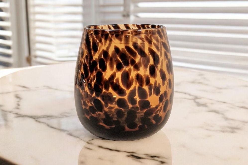 Geko Products leopard print glass vase in brown and black spotted design on marble surface