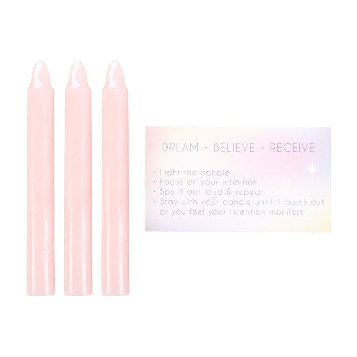 Set of pink manifestation spell candles with intention card for attracting positive energy