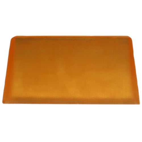 May Chang essential oil soap bar with a vibrant orange hue for refreshing cleansing
