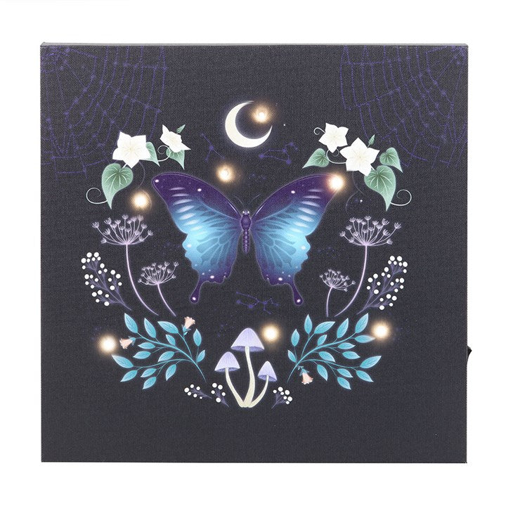 Midnight moth wall art featuring a glowing butterfly design with floral elements and a crescent moon