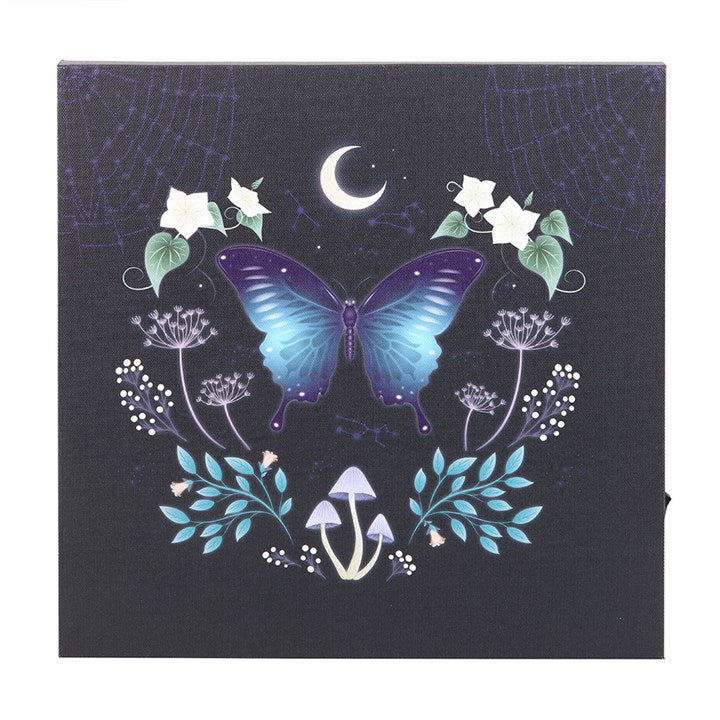 Midnight Moth Wall Art featuring a luminous butterfly and floral design on a dark canvas plaque