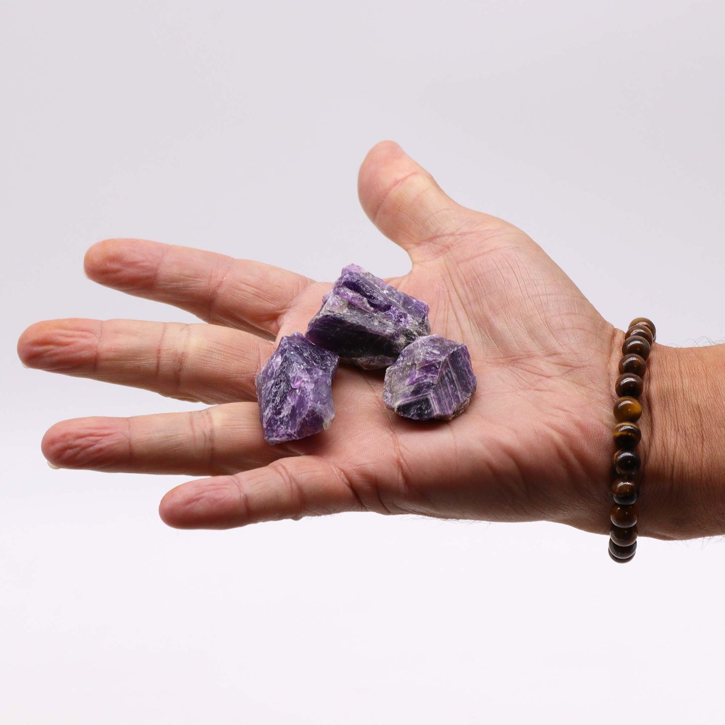 Unpolished Amethyst raw crystals with rich violet tones, perfect for meditation, Reiki, and crystal grid setups.