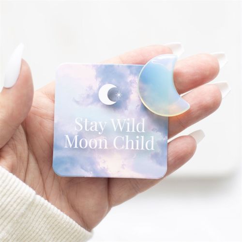 Stay Wild Opalite Crystal Moon displayed with a decorative card in a bag