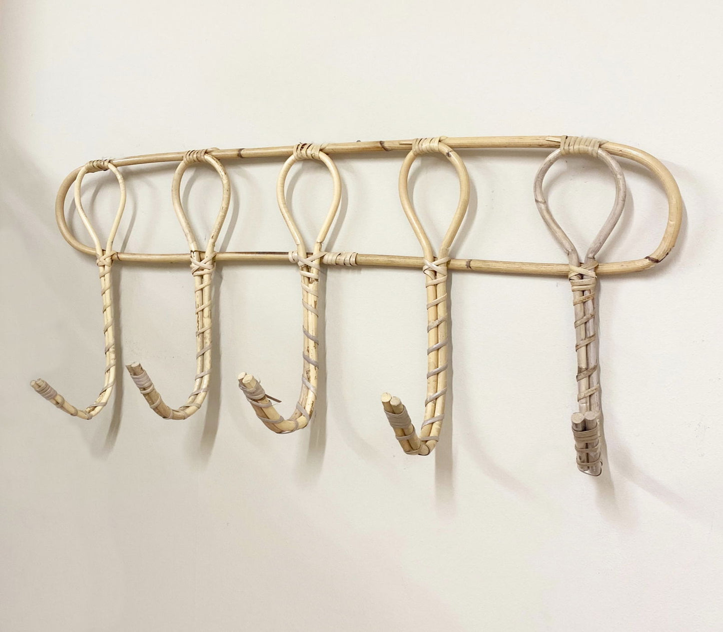 Geko Products natural rattan wall hooks set with five loops mounted on a white wall