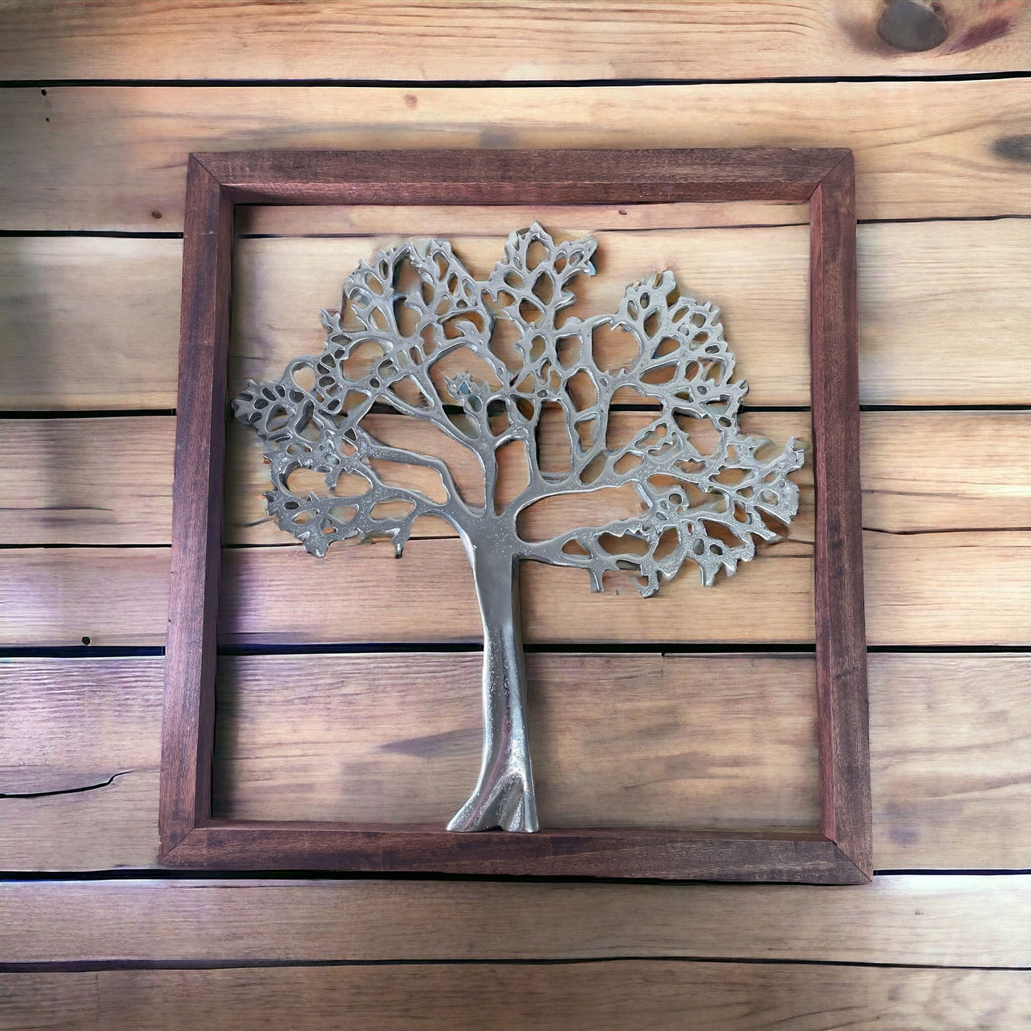 Geko Products Silver Tree of Life Wall Art in a wooden frame on a plank wall background