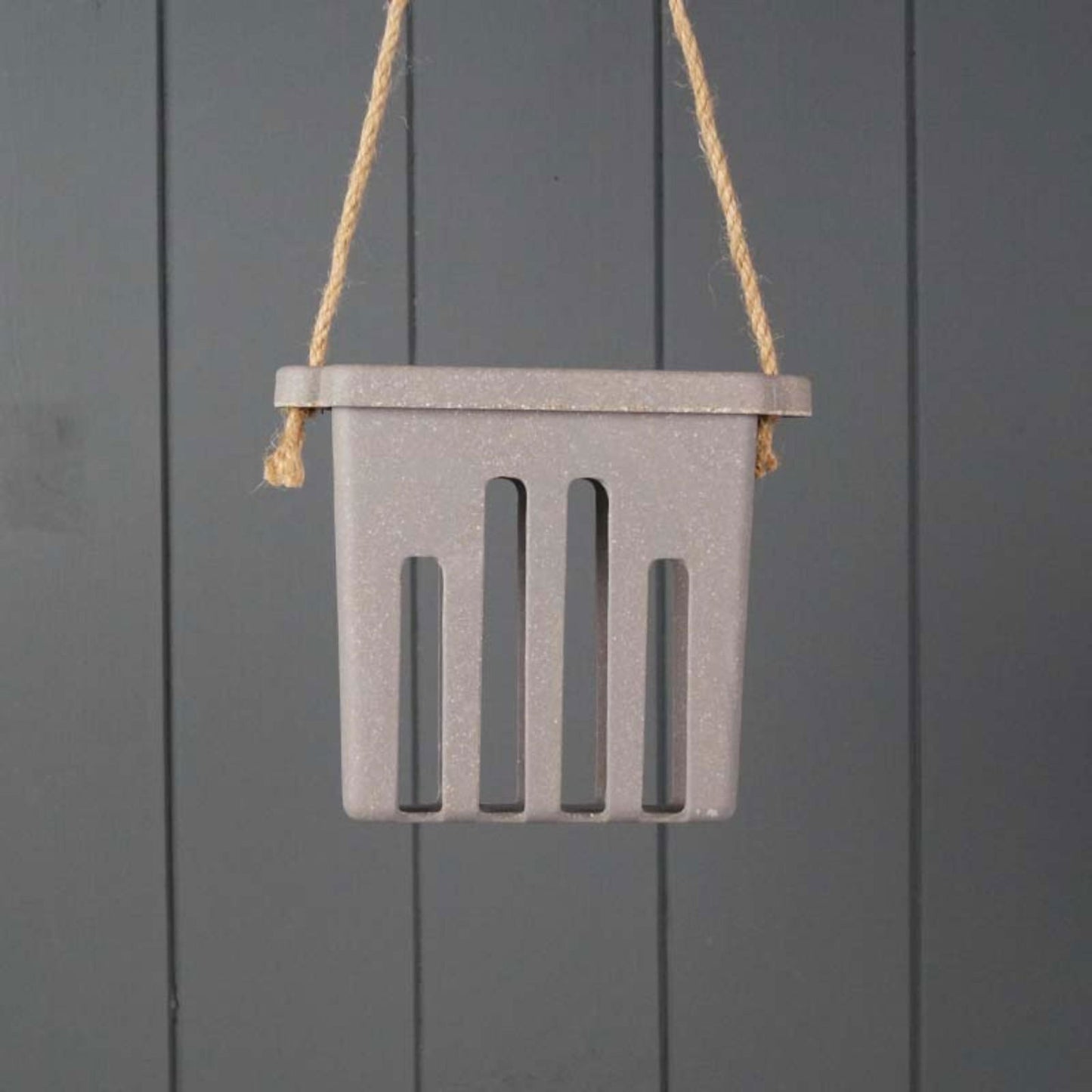 Geko Products gray hanging Straw suet cake holder with vertical slots and rope hanger