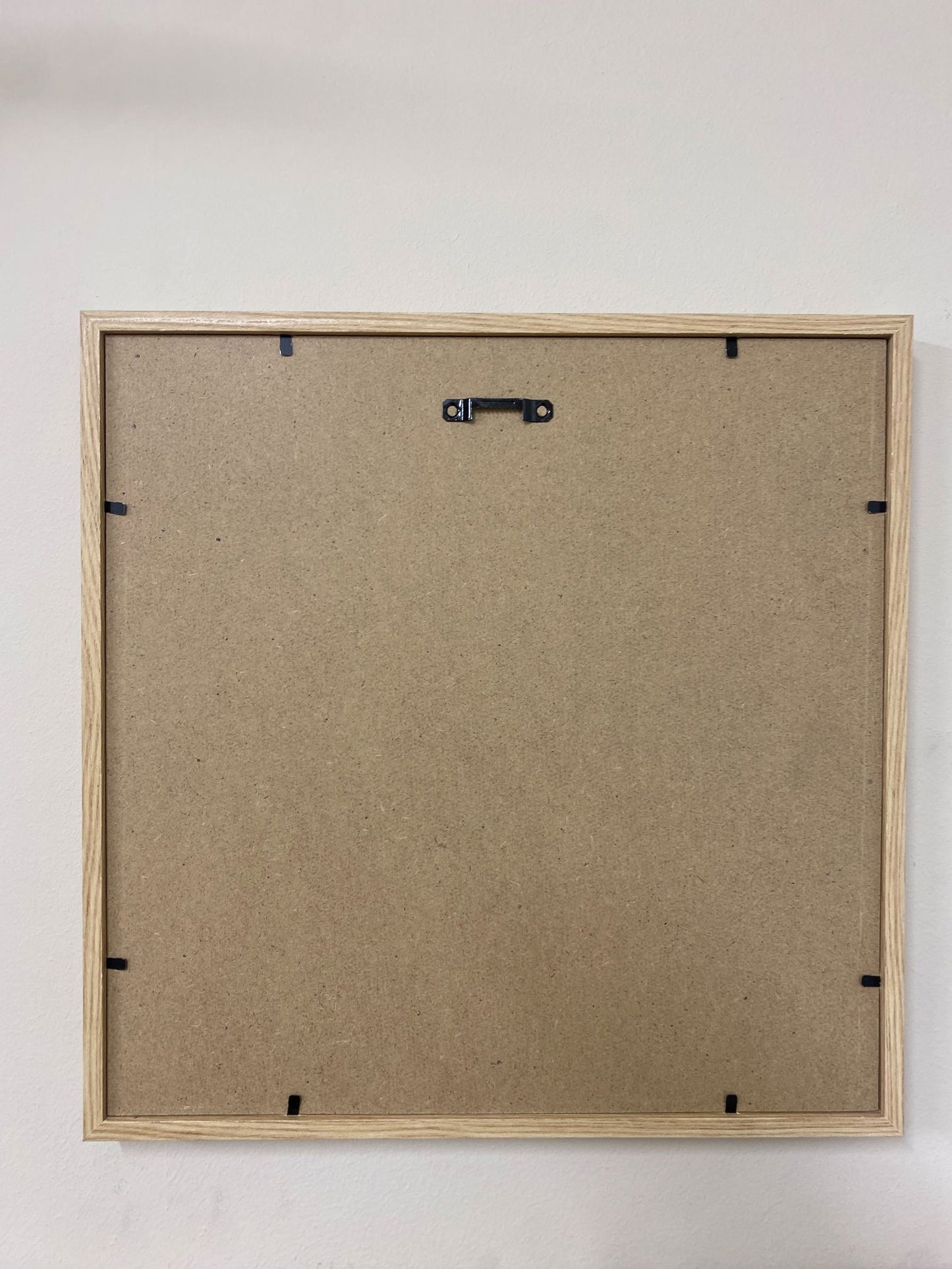 Back view of Geko Products sunburst frame set showing hanging hardware and natural wood finish
