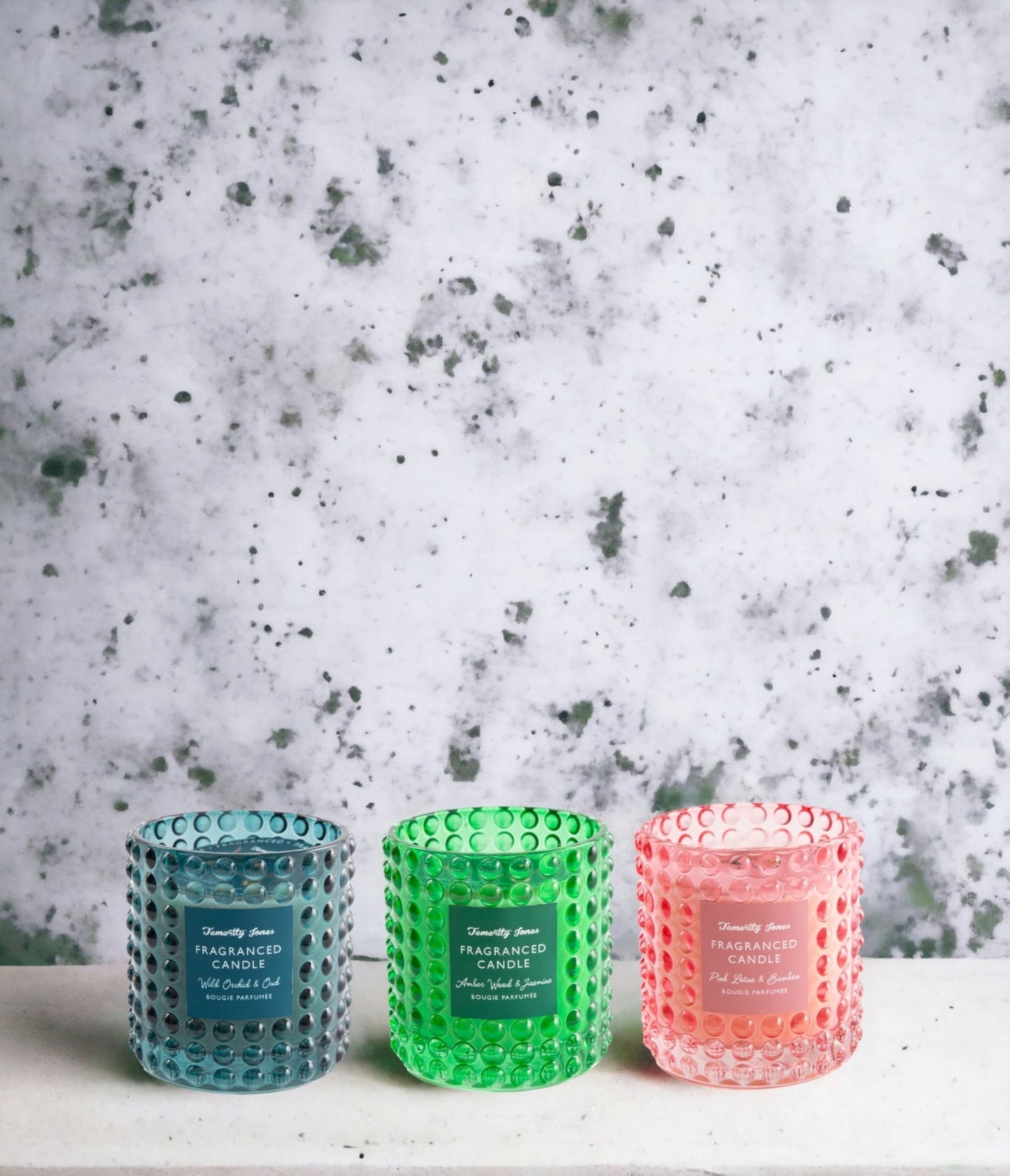 Set of blue green and pink decorative glass candles with textured bubble design by Geko Products