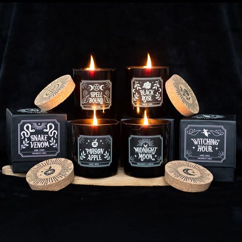 Set of 6 Midnight Ritual Candles in dark jars featuring Spell Bound, Black Rose, Snake Venom, Poison Apple, Midnight Moon, and Witching Hour.