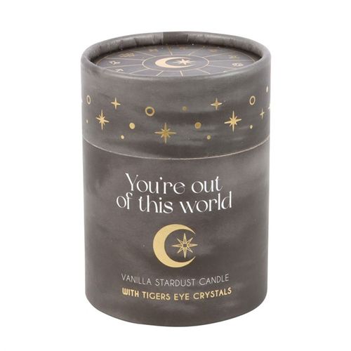 A glass holder with 'You're out of this world' text and matching astrological lid are accented by a scattering of Tiger's Eye crystal chips