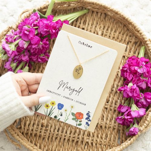 Beautiful October birth necklace card featuring a marigold design, held among vibrant flowers, perfect for gifting