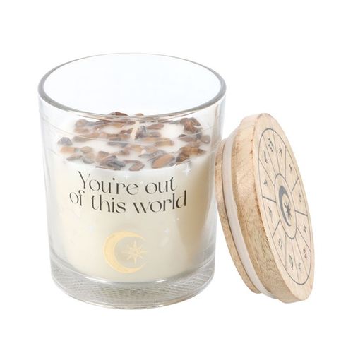 Vanilla Stardust candle with crystals in a clear glass container featuring a celestial design and wooden lid