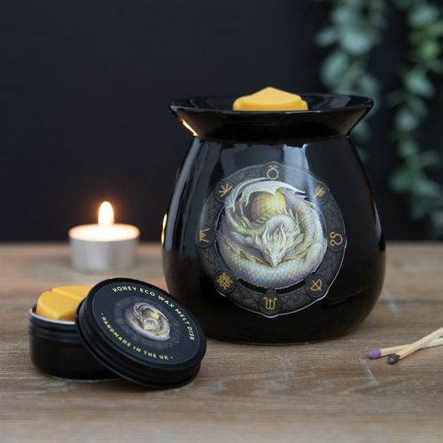 Ostara wax melt burner gift set featuring a black ceramic burner with mystical artwork and a yellow wax melt.