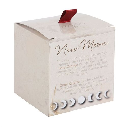 New Moon Orange Candle with Clear Quartz, designed for manifestation and clarity, in an elegant white box with red accents