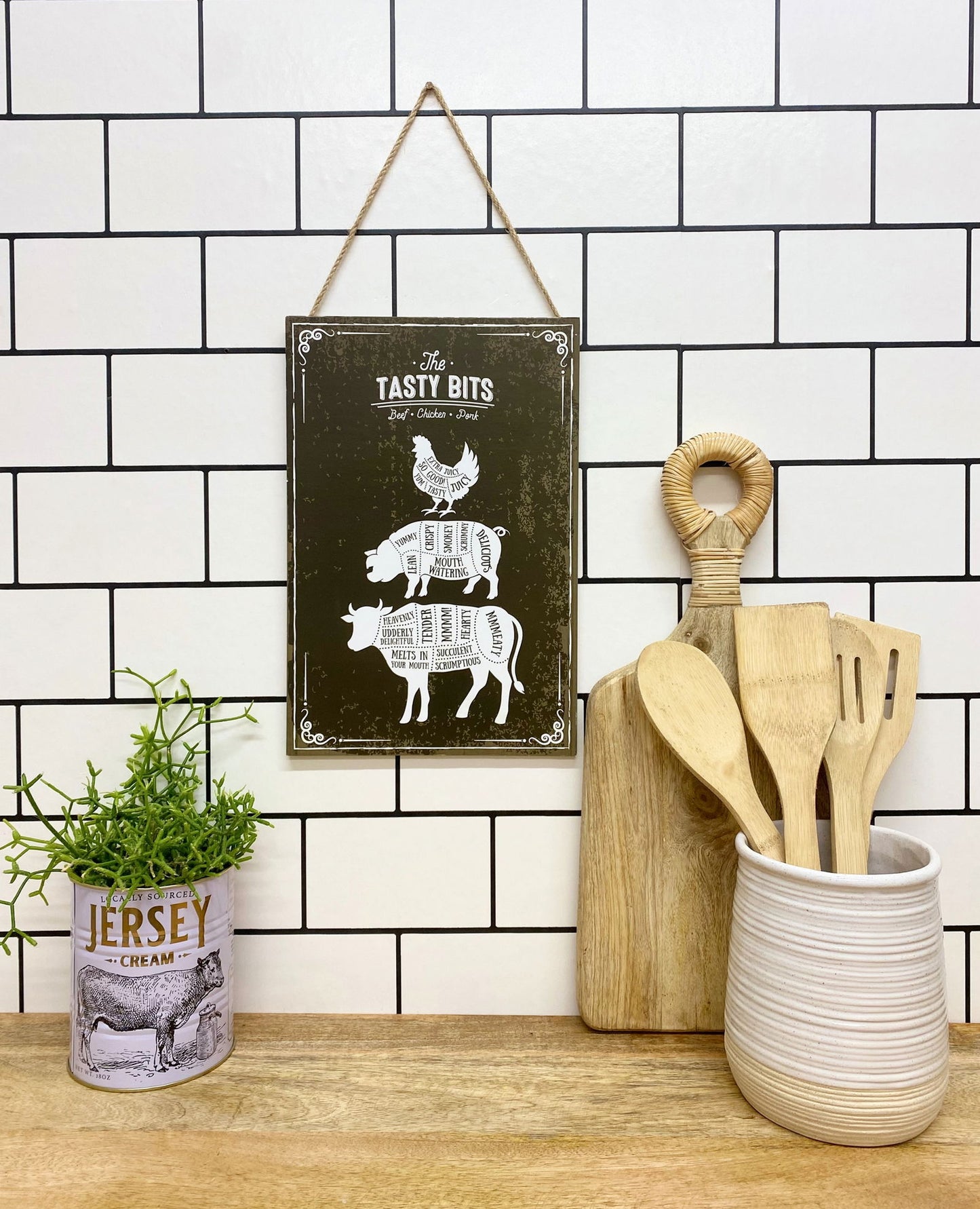 Geko Products wooden hanging plaque with farm animal cuts chart hanging on tiled kitchen wall