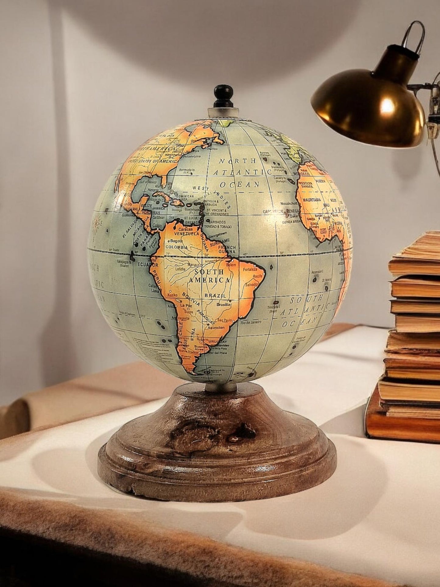Geko Products vintage style world globe spiritual decor with wooden base on a desk