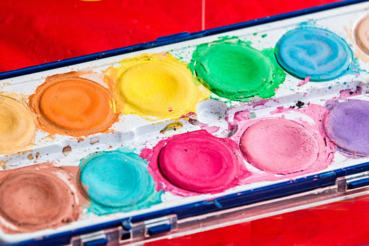 Colourful watercolor palette showcasing vibrant hues highlighting color therapy benefits