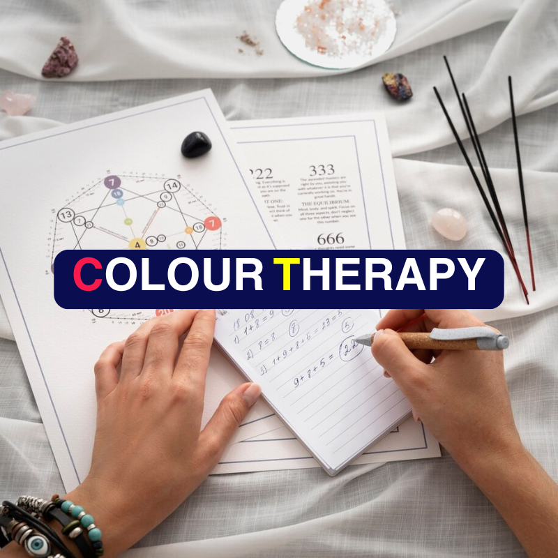 A calming therapy room illuminated with soft coloured lights, showcasing a peaceful colour therapy session in progress.