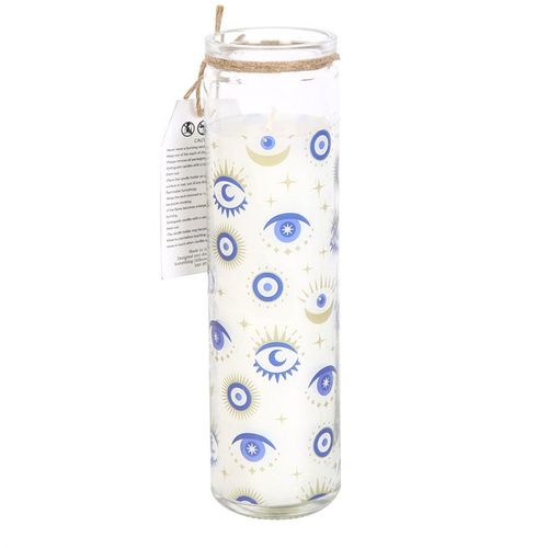 Tall glass candle with eye designs.