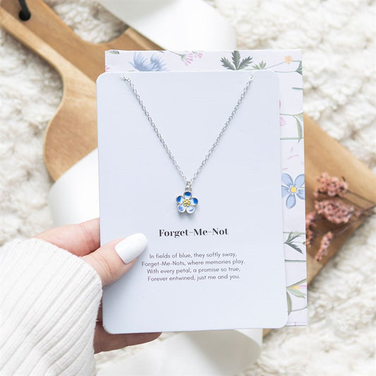 Forget Me Not Flower Necklace displayed on a greeting card with floral design, perfect for gifting or personal keepsakes