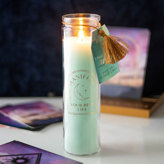 White Sage Tube Candle with clear quartz crystals, featuring a warm flame and decorative tag, ideal for manifesting intentions.