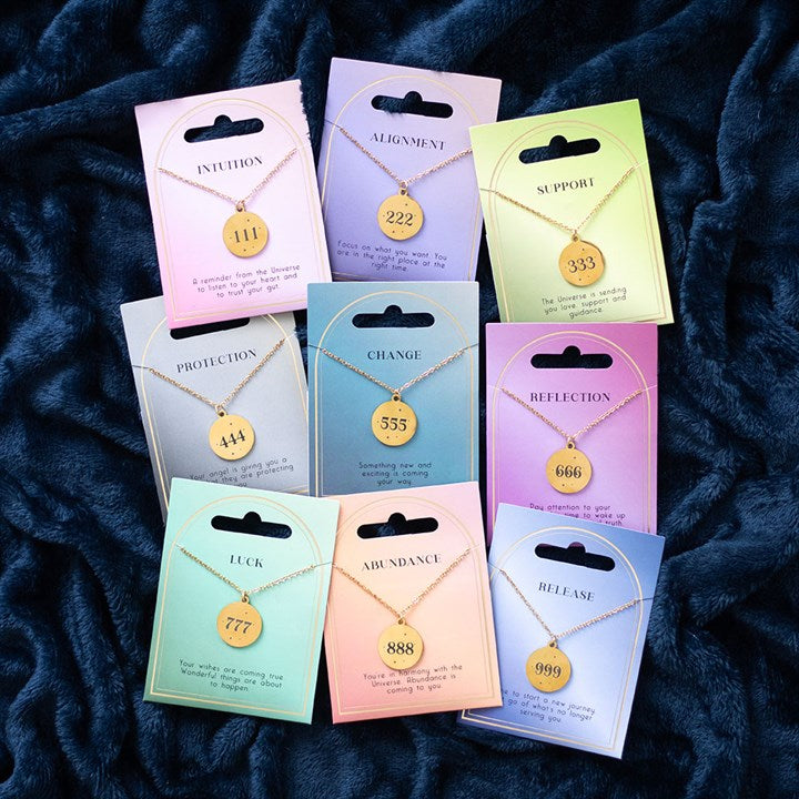 Gold 444 angel number necklace displayed with colorful packaging, symbolizing protection and spiritual guidance
