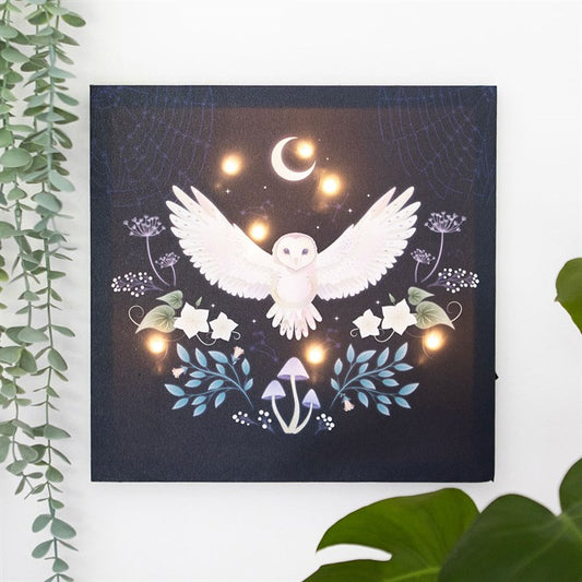 Enchanting light up canvas owl art featuring a soaring owl and mystical elements, perfect for home decor